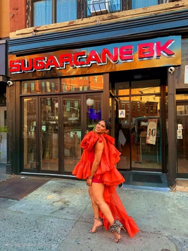 Customer photo review of Orange Earlene Ruffle Top