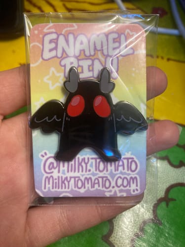 Customer photo review of Mothman Enamel Pin