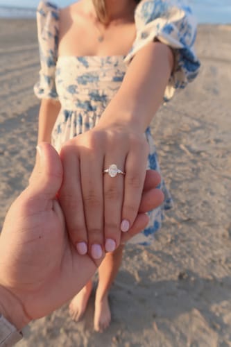 Customer photo review of 2.40 Carats Lab Grown Oval Cut with Pear Shape Side Stones Diamond Engagement Ring in Yellow Gold