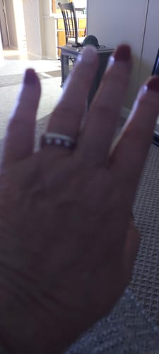Customer photo review of Seven Stone Moissanite and Ruby Wedding Band Ring In Sterling Silver