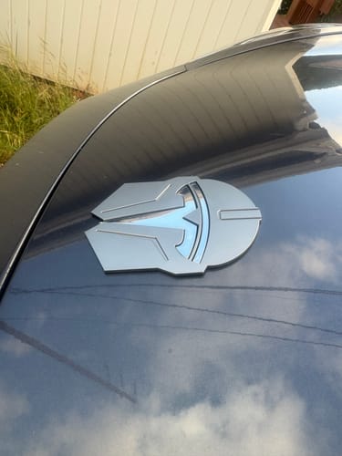 Customer photo review of Madalorian Star Wars T Logo Surround Emblem Badge For Model 3 & Y 2017-2024