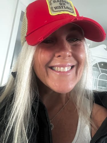Customer photo review of Raised on Waylon Jennings Distressed Red Trucker Hat