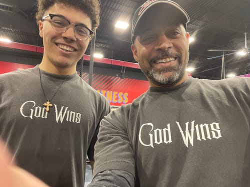 Customer photo review of God Wins Tee