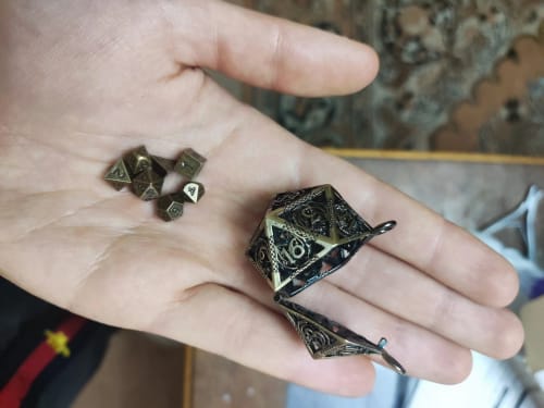 Customer photo review of Hollow Dragon D20 Mini-Dice Cage Necklace