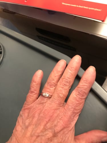 Customer photo review of Solitaire Oval Moissanite Half Bezel Set Engagement Ring