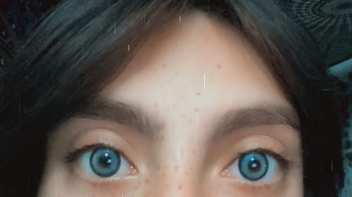 Customer photo review of Aine Swan Lake Blue Prescription Colored Contact Lenses