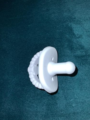 Customer photo review of Newborn Teether Pacifiers 2 in 1 (6 Months onwards)