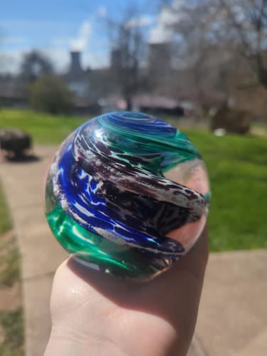 Customer photo review of Blue & Green Cat Eye Orb with Cremation Ashes