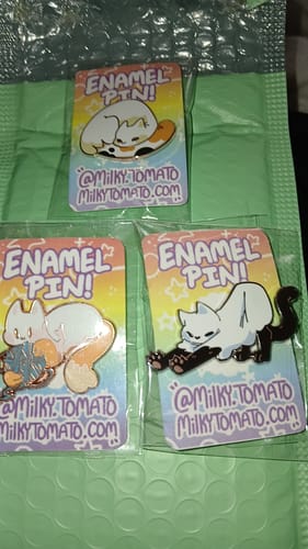 Customer photo review of Cute Ghost Cat Enamel Pins