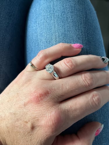 Customer photo review of Solitaire Moissanite Half Bezel Set Sterling Silver Engagement Ring