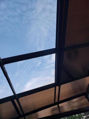 Customer photo review of SUNJOY 10x12 Polycarbonate Roof Lean to Gazebo, Wall Mounted Gazebo with Curtains and Netting