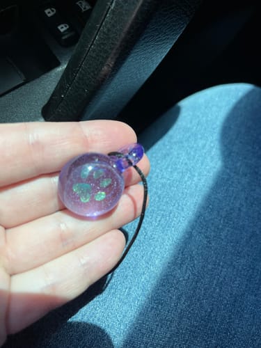 Customer photo review of Pawprint Foil Pendant with Cremation Ash