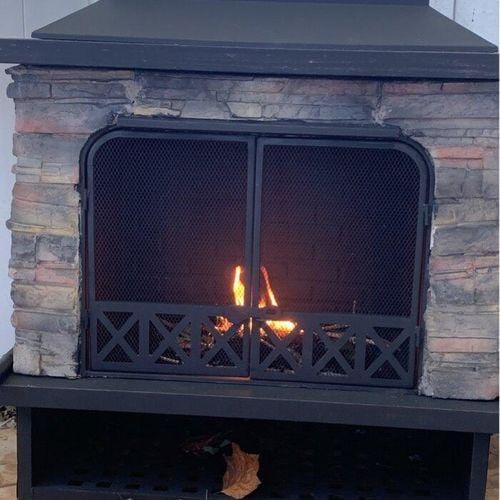 Customer photo review of SUNJOY Outdoor 48 Inch Black Steel Wood Burning Stone Fireplace with Fire Poker and Removable Grate