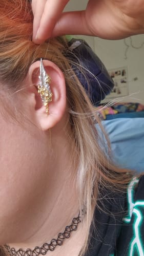 Customer photo review of "Lucifer White" 18K Gold Plated Statement Feather Threader Needle Piercing Earring, Dangle Feather Jewelry