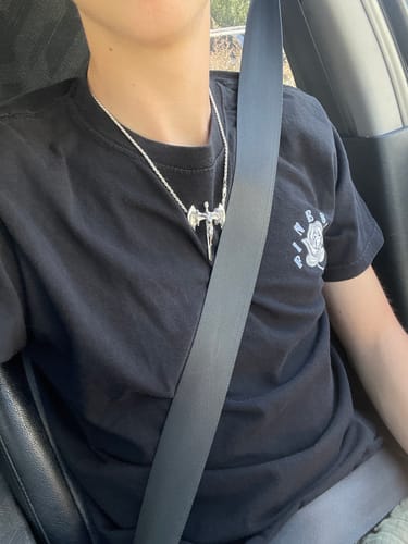 Customer photo review of RELIGION IS WAR PENDANT