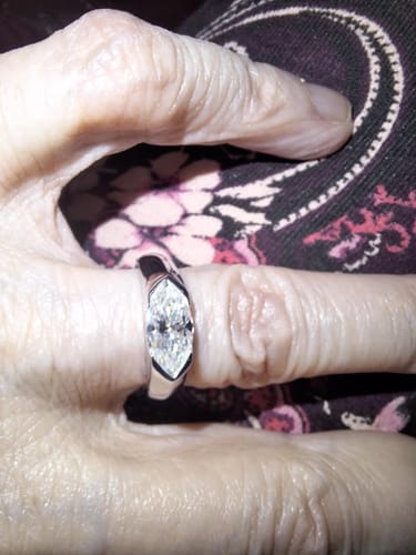 Customer photo review of Solitaire Marquise Moissanite Half Bezel Set Engagement Ring