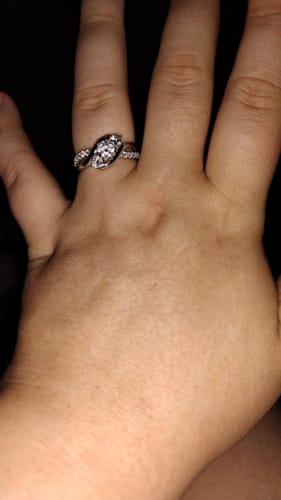 Customer photo review of Swirl Three Stone Moissanite Twisted Pave Engagement Ring