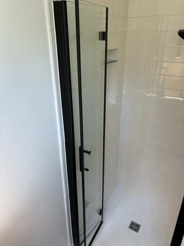 Customer photo review of SUNNY SHOWER 1/4 inch Bifold Shower Door with Semi-Frameless Clear Tempered Glass, Black Finish / Chrome Finish