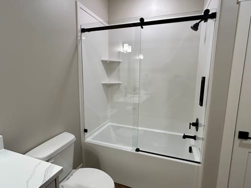 Customer photo review of SUNNY SHOWER 60" x 62" Bathtub Shower Door & Frameless Sliding Door for tub, Black Finish / Brushed Nickel Finish