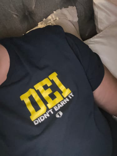 Customer photo review of Didn't Earn It T-Shirt