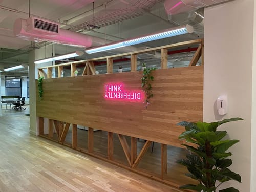 Customer photo review of Think Differently Neon Sign