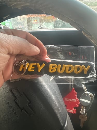 Customer photo review of Hey Buddy Yellow PVC Keychain