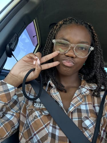 Customer photo review of Outre Synthetic Hair Crochet Braids X-Pression Twisted Up 3X Springy Afro Twist 16"