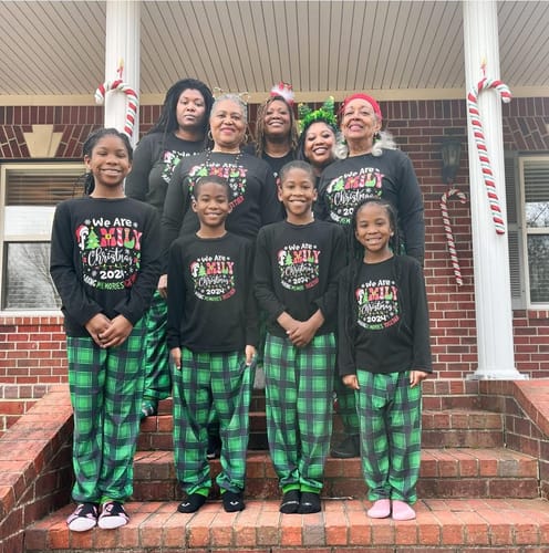 Customer photo review of "We are Family" 2024 Christmas Wreath - Black Long Sleeve Top with Black And Green Plaid Pants Family Matching Pajamas