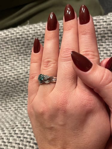 Customer photo review of Green Moissanite Side Stone Engagement Ring