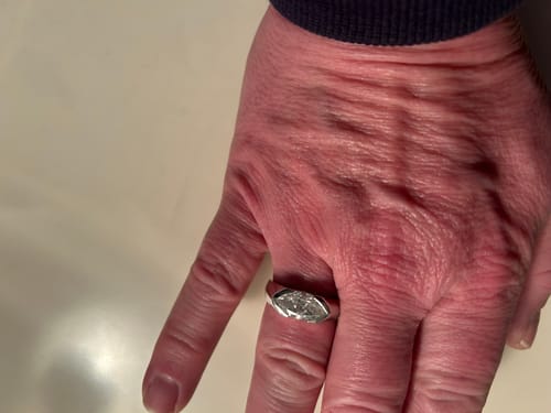 Customer photo review of Solitaire Marquise Moissanite Half Bezel Set Engagement Ring