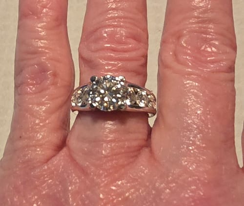 Customer photo review of Round Moissanite Graduated Channel Set Accents Engagement Ring