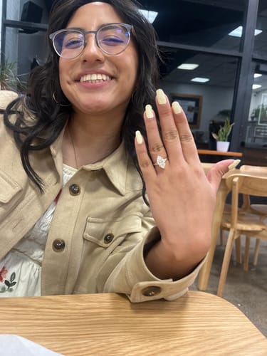 Customer photo review of Lylah 2 Carat Marquise Cut Side Stone Moissanite Diamond Ring in 14k Yellow Gold