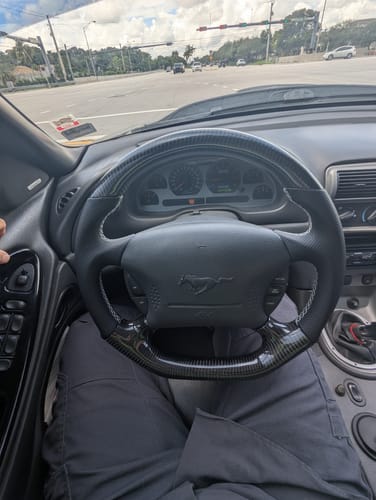 Customer photo review of Carbon Fiber Flat Bottom Steering Wheel for 1994-2004 Ford Mustang SN95 & New Edge | No Top Stripe, Black Perforated Leather, Silver Stitching
