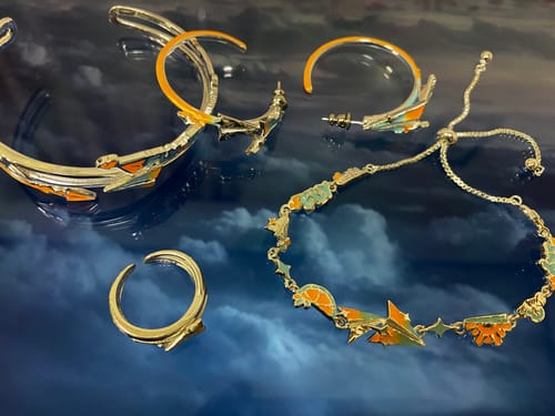 Customer photo review of "Juicy Flight" Platinum Plated Dainty Paper Airplane Enamel Charm Bracelet