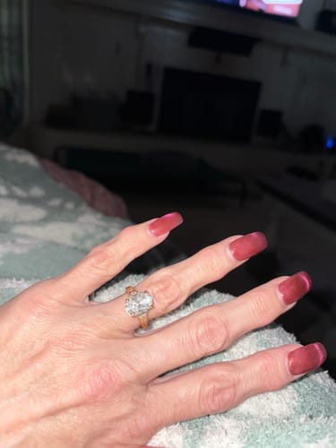Customer photo review of Taylor 4 Carat Elongated Cushion Cut Moissanite Diamond Ring in 14k Yellow Gold