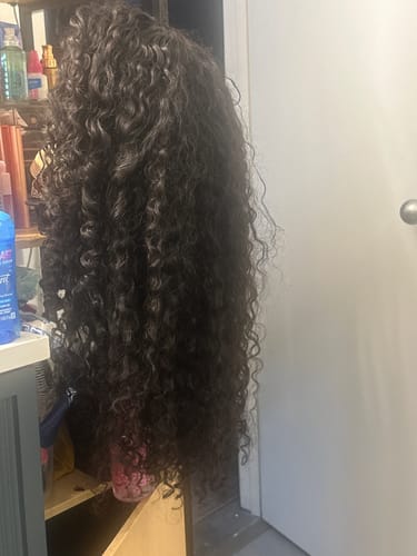 Customer photo review of CurlyMe Pre-bleached Wear Go Glueless Wig 7x5 Pre-cut HD Lace Burmese Curly Human Hair