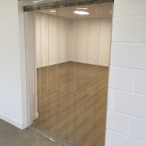 Customer photo review of Energy-Saving Workshop & Unit Door Curtains - Clear PVC, Hook-On, Stainless Steel Rail Kit, Dust & Noise Control, Up to 4000mm High