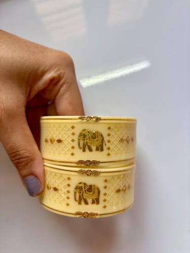 Customer photo review of "Exclusive Cream & 916 22 (carats Gold) Elephant-Inspired Bangle"