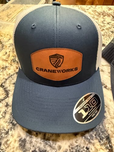 Customer photo review of Custom Leather Patch Trucker Hat - Flexfit 110