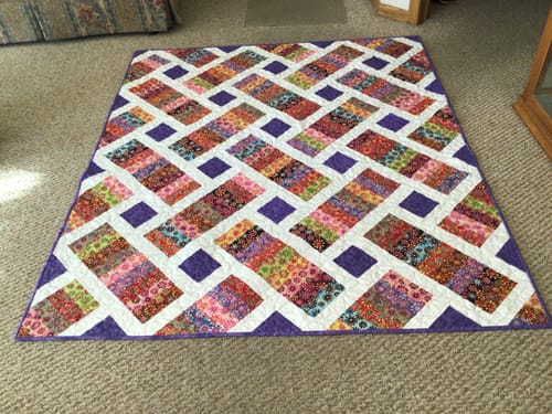 Customer photo review of Crazy Daisy Quilt Kit Fabric Pattern and Binding and backing Included ALL PRE CUT Iris pattern Kitchen table quilts 59 X 69 Beginner