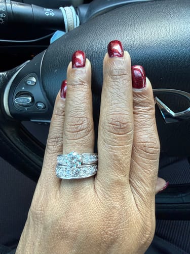 Marlena R. review of Round Moissanite Triple Channel Set Engagement Ring image 1 out of 3