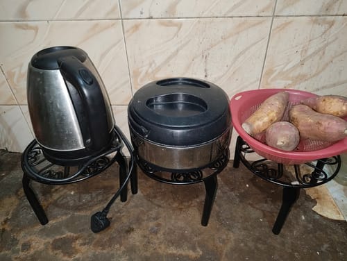 Customer photo review of UnitedCrafts Trivia Metal Pot Stand High Quality & Unique Design