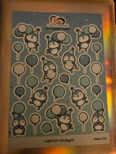 Customer's sticker sheet from the Sticker Subscription featuring cute Party Penguins with blue balloons.