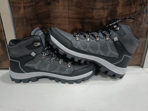 Reviewer's grey and black Bacca Bucci Wild Track shoes, with one showing its thick, treaded sole.