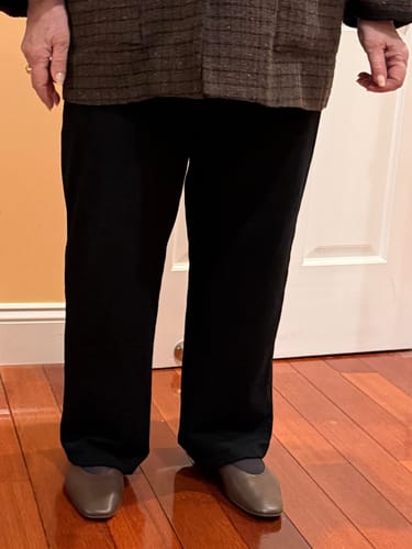 Reviewer standing indoors wearing the black Ellie Wide Leg Pants, showing the relaxed fit.