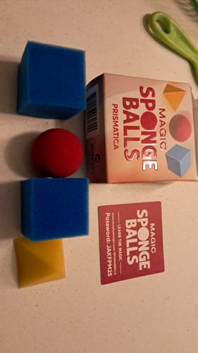 Reviewer's Prismatica Sponge Mystery kit showing the box, colorful sponge shapes, and instruction card on a table.