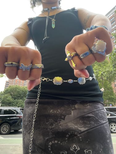 Reviewer's hands adorned with many silver rings, including the detailed UPGRADED CATACOMBS RING.