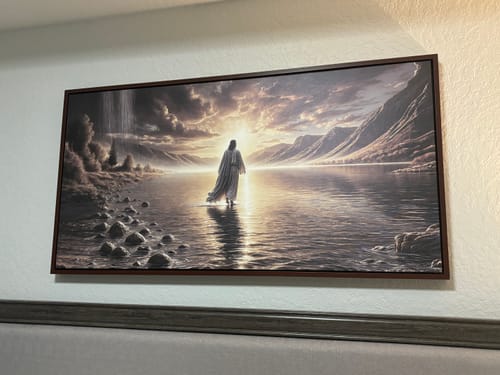 Customer's 'Walking on Water - Faith Wall Art II' hanging on a wall in their room, showing a figure walking on water towards a sunrise.