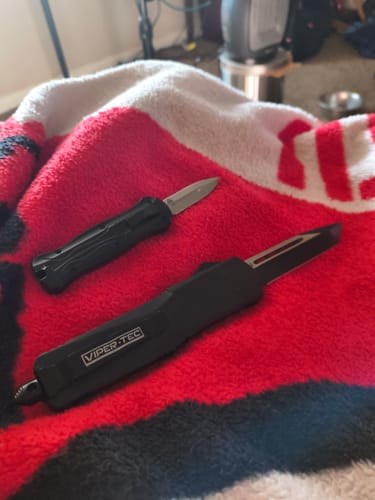 Customer's VT Black Rocket Mini OTF Knife with the blade out, shown next to a larger Viper-Tec knife.