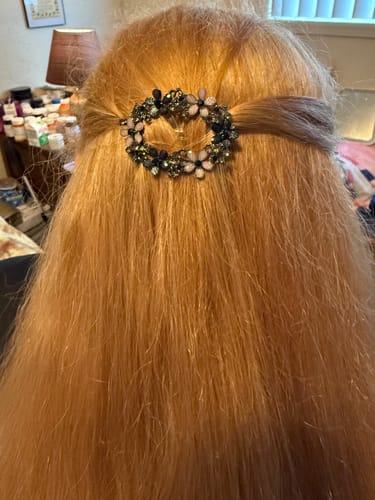 Customer's vibrant, light red hair after using the Instant Dye Shampoo, shown from the back.